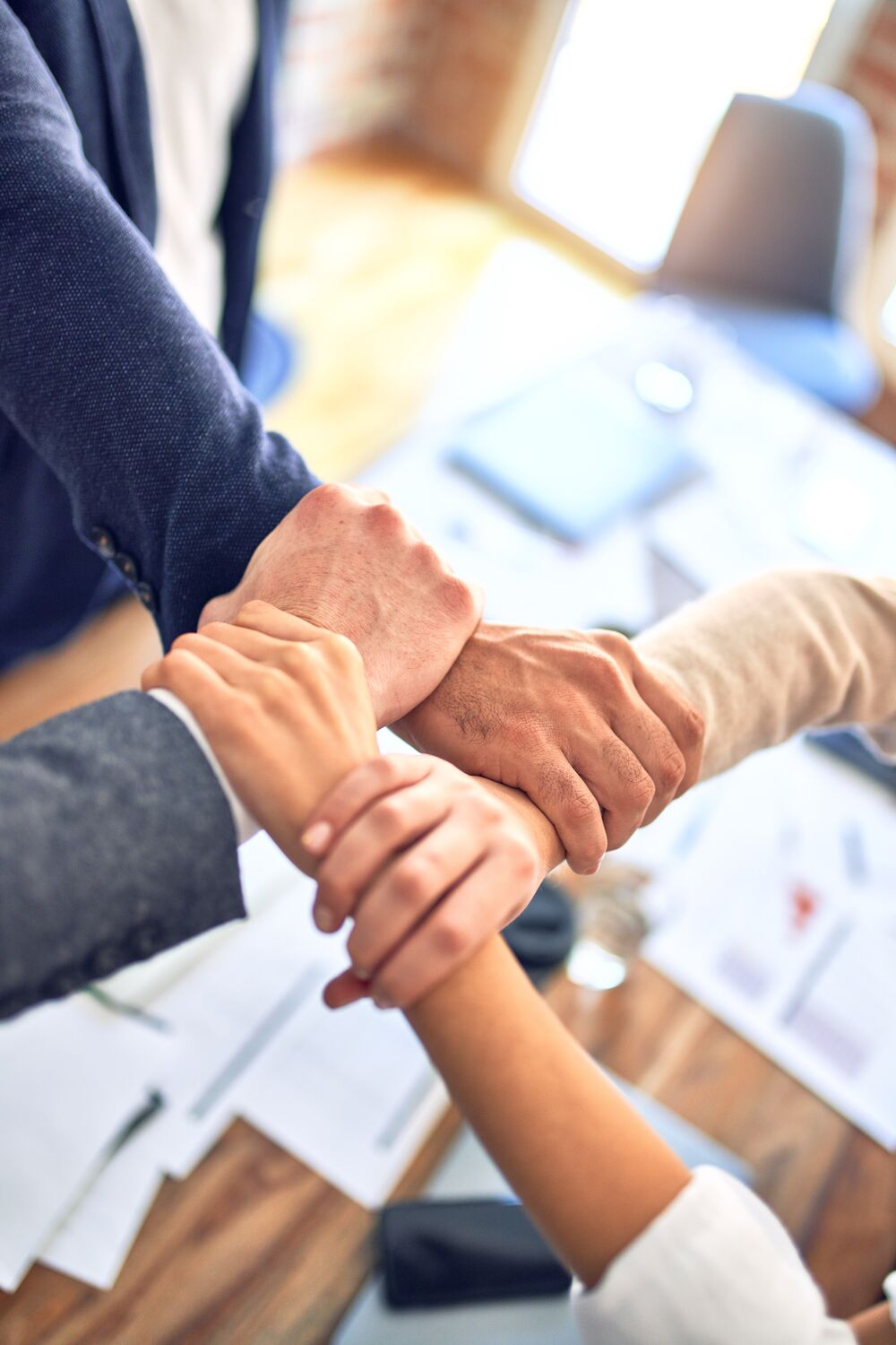 Team stacking hands together